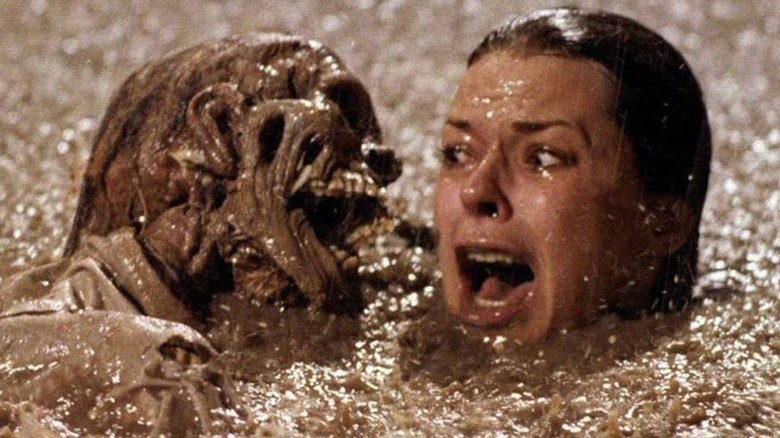 Diane stuck in the muddy hole with the skeletons in Poltergeist