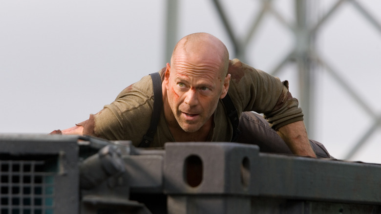 John McClane climbing bridge