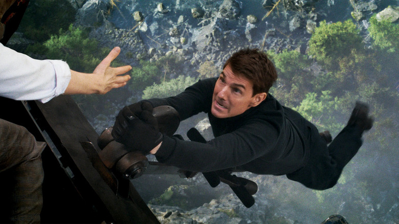 Ethan Hunt dangles from falling train