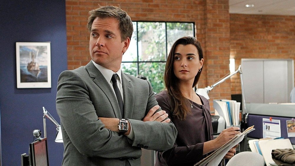 Tony and Ziva examine files