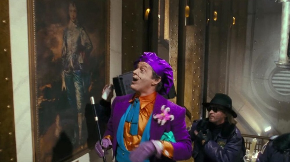 Joker smiling at painting