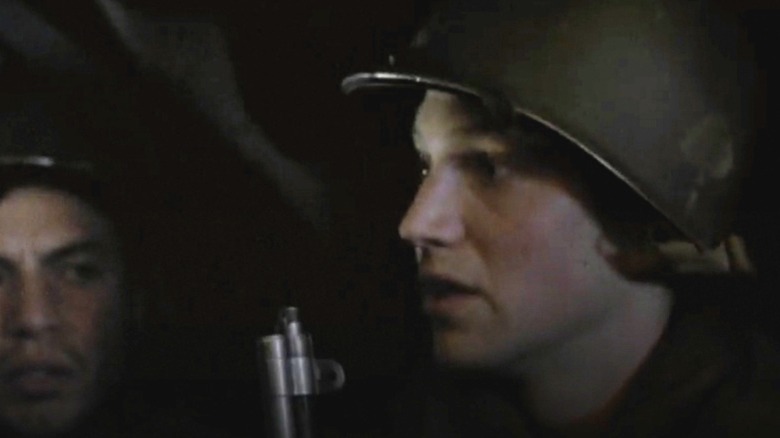 Suerth riding in a truck in Band of Brothers