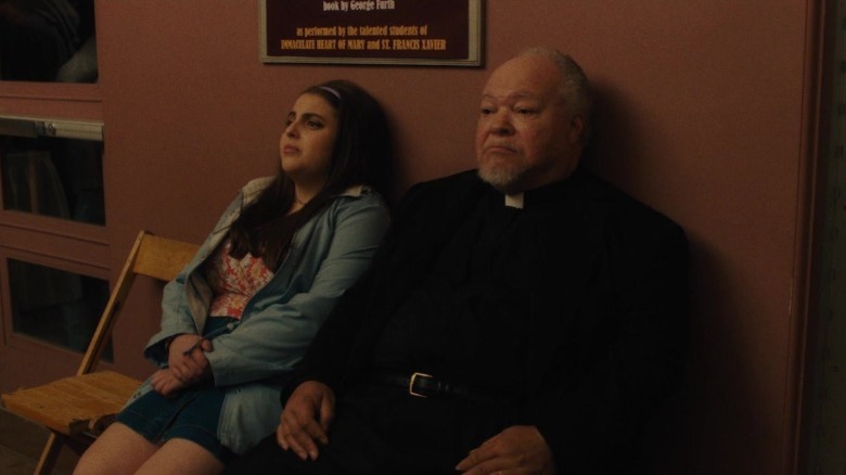 Julie Steffans and Father Leviatch sit and frown