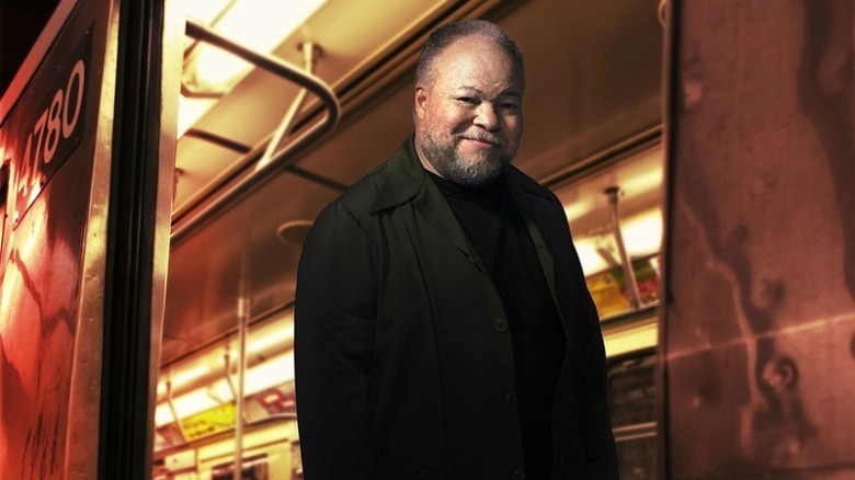 Omar York standing at a train door