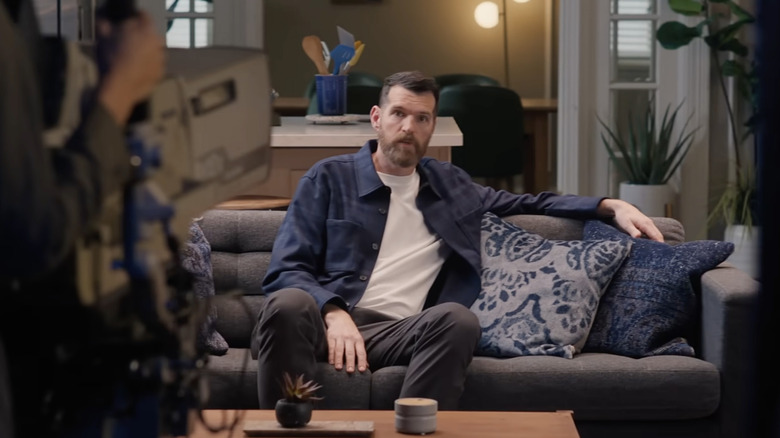 Timothy Simons shooting a commercial on a couch in a Coors Light Super Bowl ad