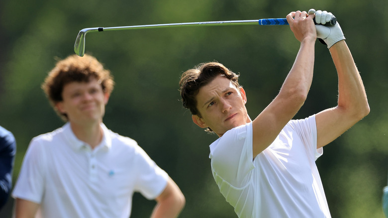 Tom Holland golfing