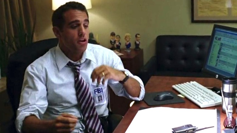 Bobby Cannavale sitting at desk in Snakes on a Plane