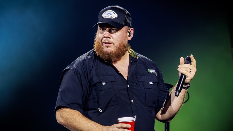 Luke Combs singing onstage