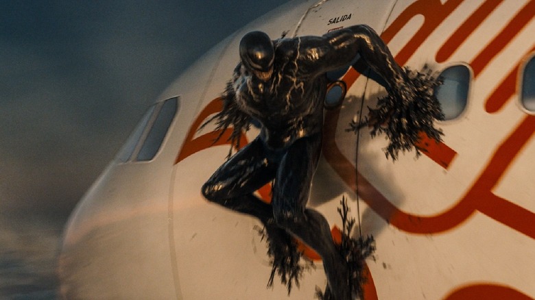 Venom hangs on the side of an airplane in The Last Dance