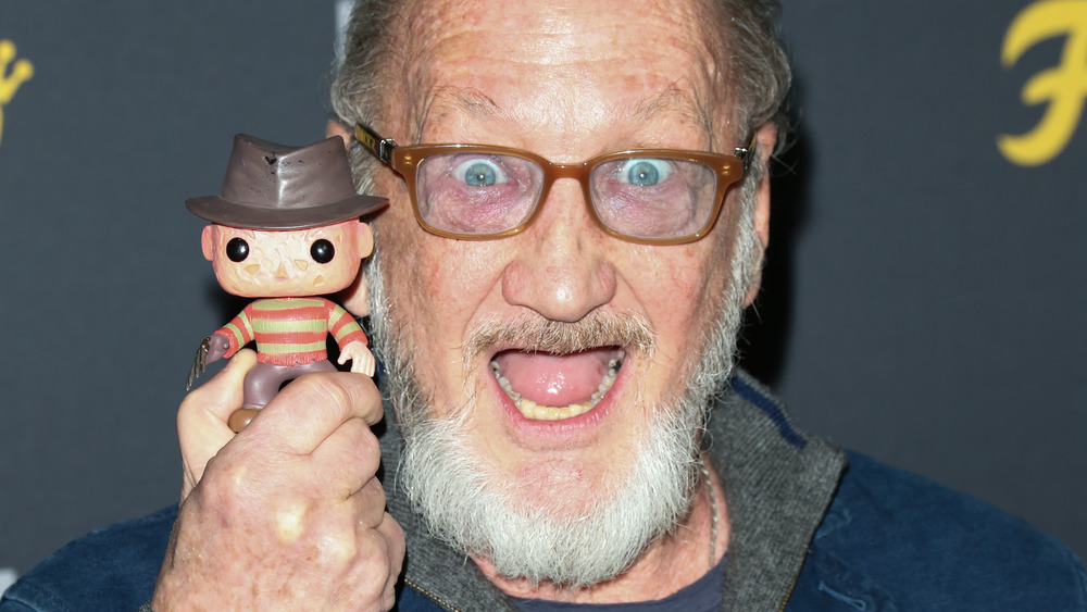 Robert Englund holding bobblehead