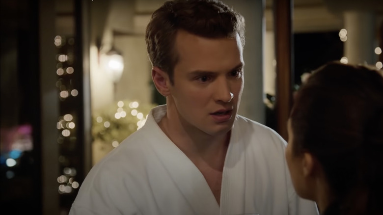 Freddie Stroma wearing white robe