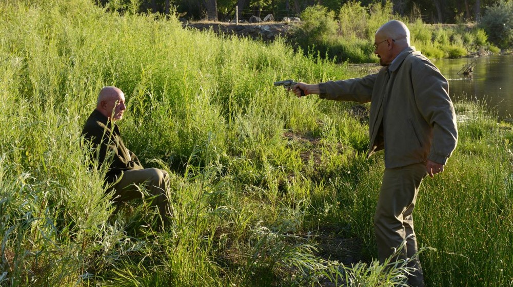 Walter White pointing a gun at Mike