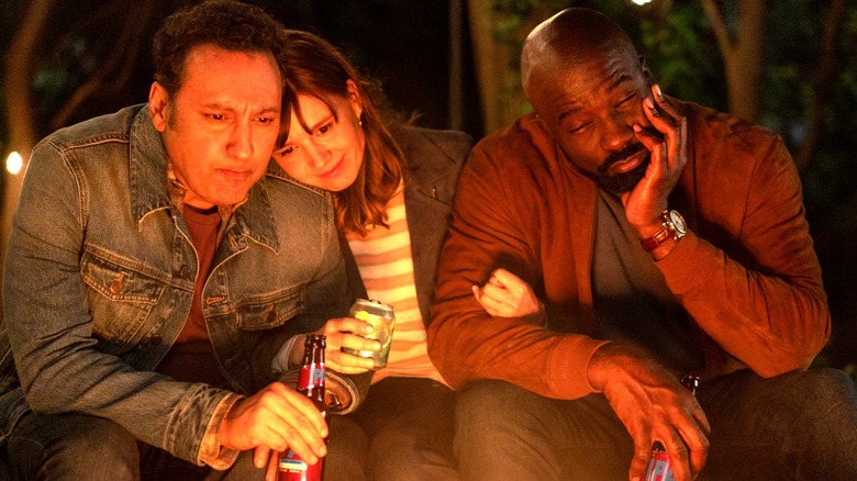 Ben, Kristen, and David enjoy a campfire together in "Evil"