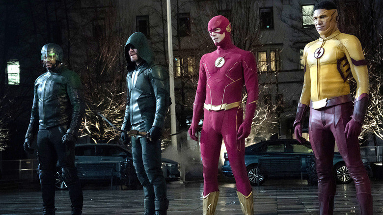 Diggle, Arrow, Flash, Kid Flash standing on street