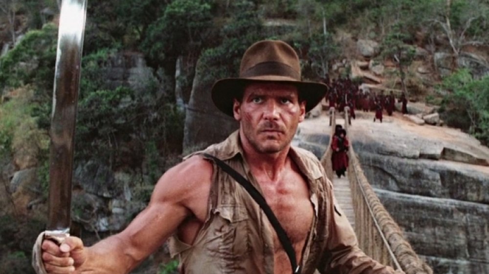 Indiana Jones confronting enemies on a bridge in Temple of Doom