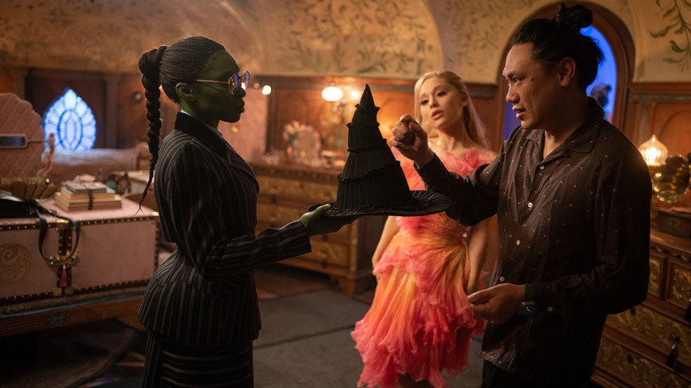 Jon M. Chu working with Cynthia Erivo and Ariana Grande on the set of Wicked