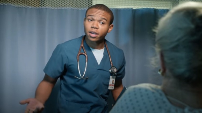 Dr. Cummings wearing scrubs