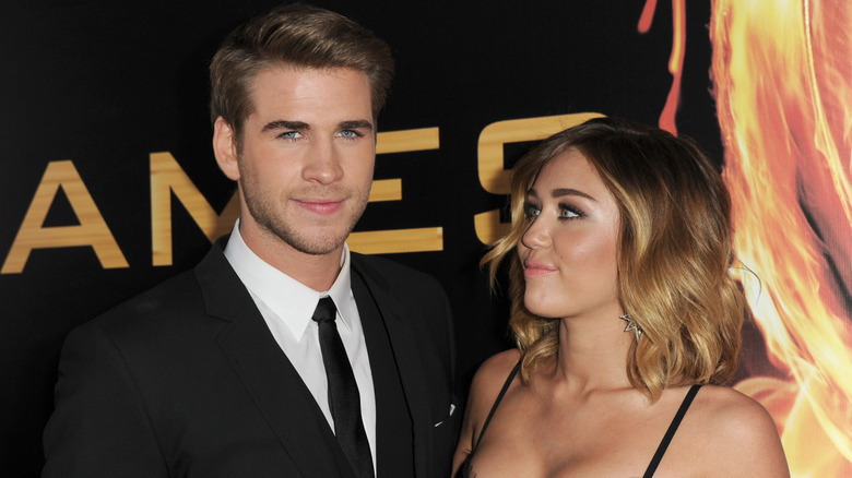 Cyrus and Hemsworth at The Hunger Games premiere