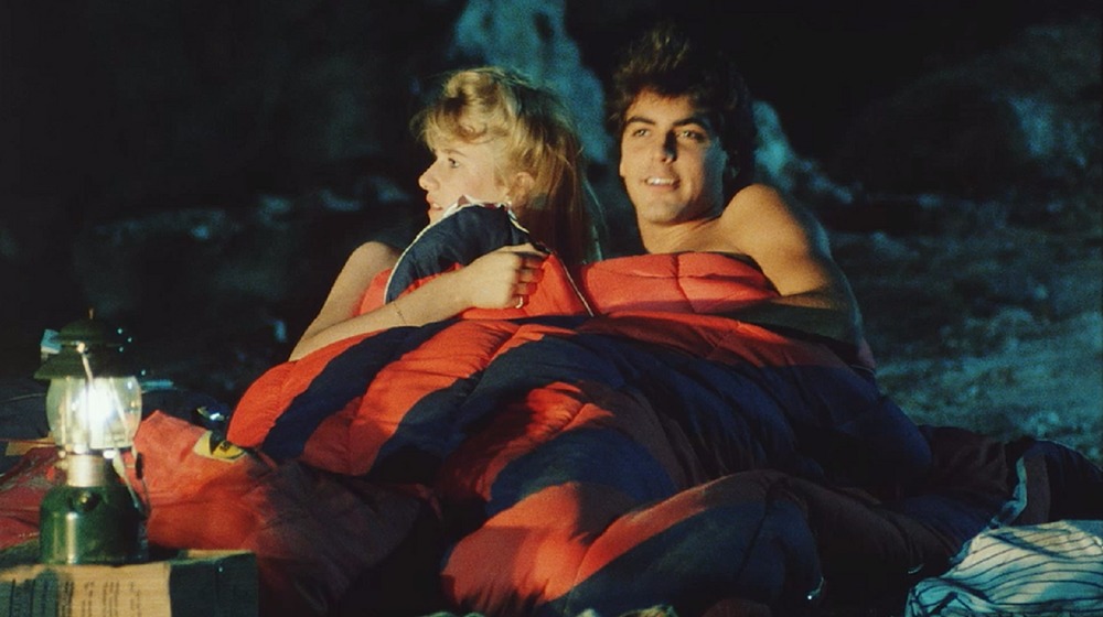 George Clooney and Laura Dern in Grizzly II: The Predator