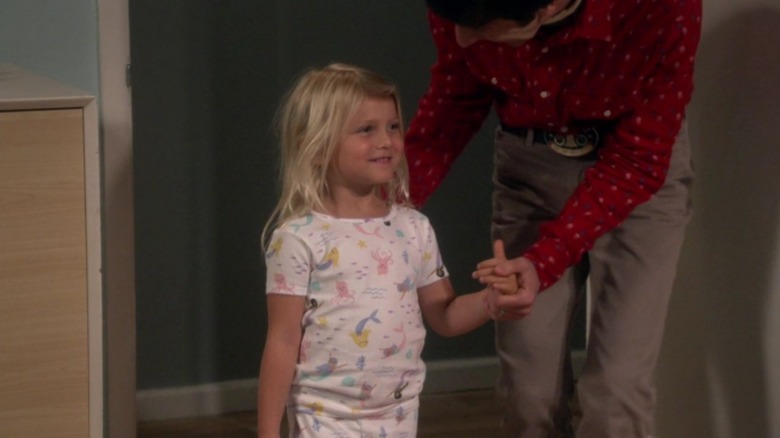 Halley Wolowitz holding Howard's hand