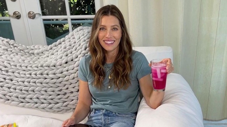 Jessica Biel holding a pink drink