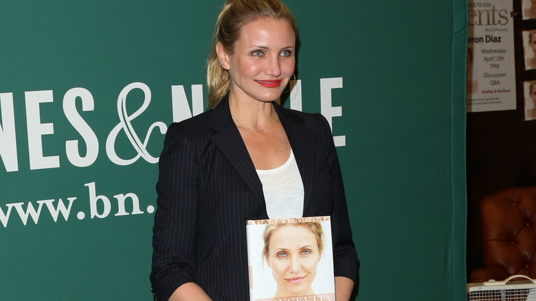 Cameron Diaz holding book