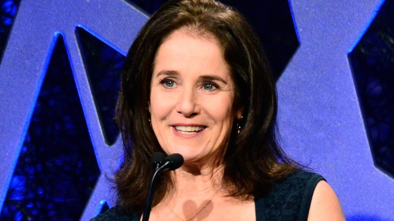 Debra Winger talking into microphone