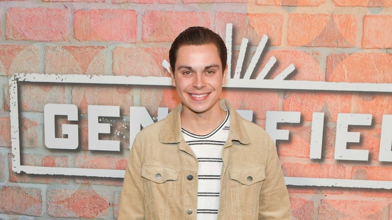 Jake. T. Austin smiles at the camera