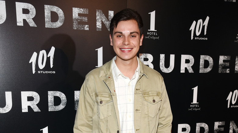 Jake smiles for the camera on red carpet