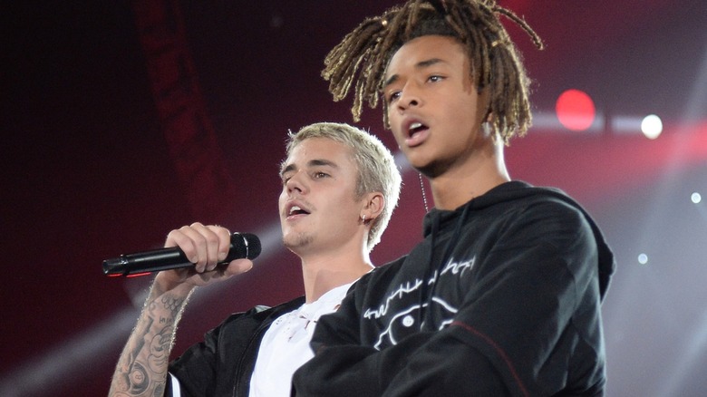 Jaden Smith and Justin Beiber stand on stage together