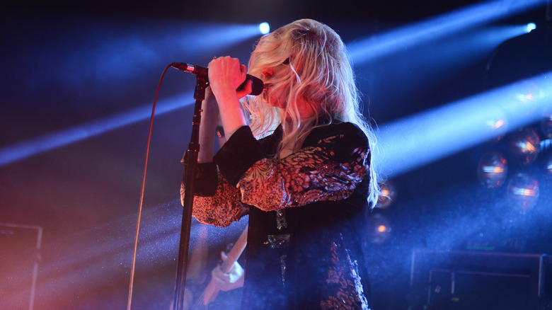 Taylor Momsen in blue stage lights