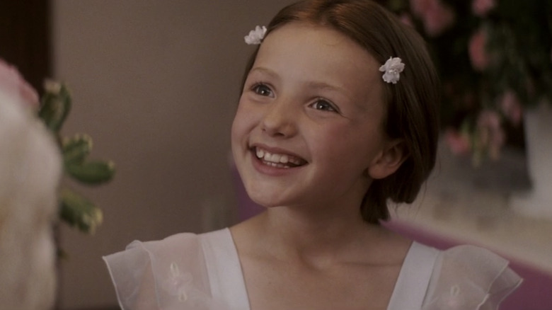 Peyton List smiling in 27 Dresses