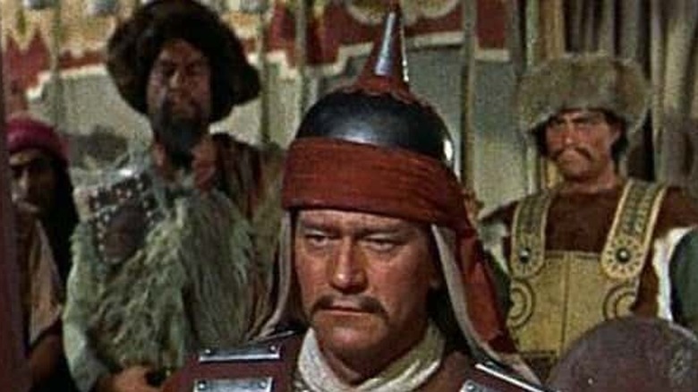 John Wayne wears a helmet