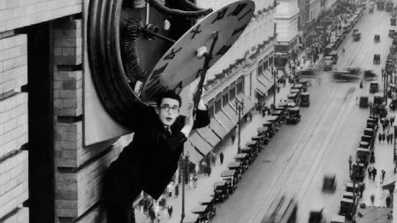 Harold Lloyd hangs from a clock