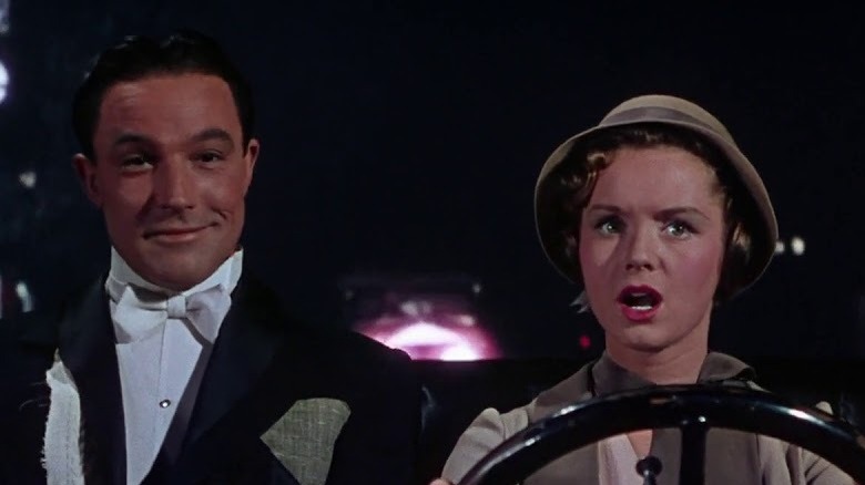 Gene Kelly and Debbie Reynolds sit together