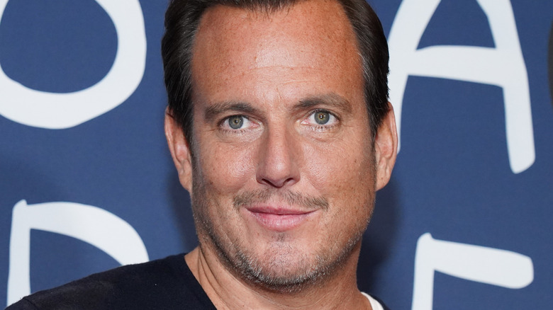 Will Arnett smirking