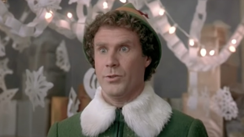 Will Ferrell wearing furry green jacket in Elf