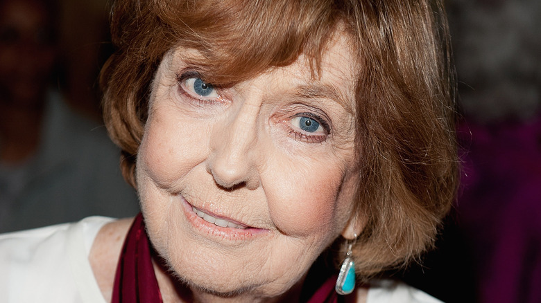 Anne Meara tilts her head while smilling