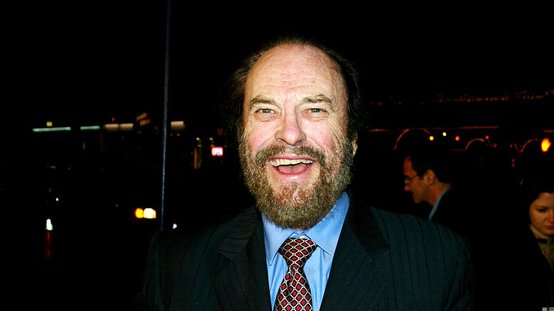 A bearded Rip Torn grins 