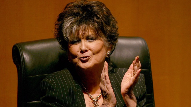 Suzanne Pleshette raises her hands while speaking