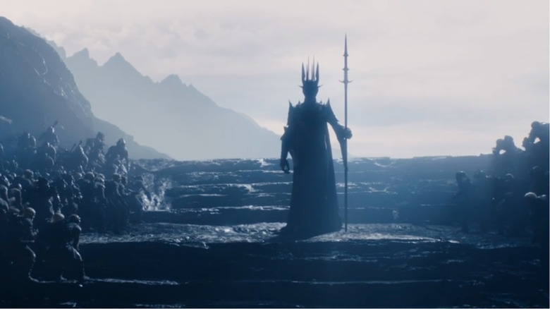 Sauron standing before his Orcs