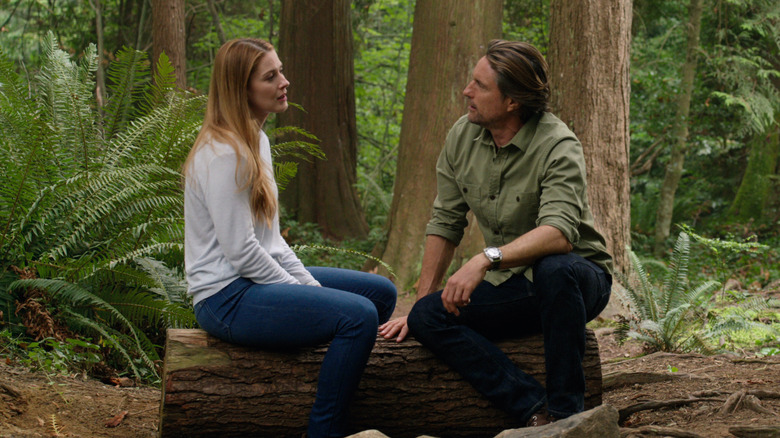 Jack and Mel sitting in the woods