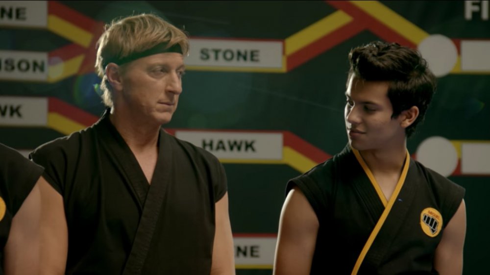 Xolo Maridueña as Miguel and William Zabka as Johnny Lawrence on Cobra Kai