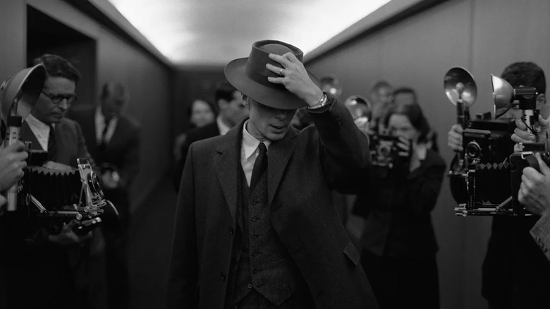 Oppenheimer with hand on hat