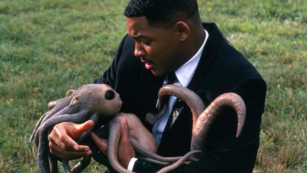 Will Smith cradles a tentacled alien as Agent J in Men in Black