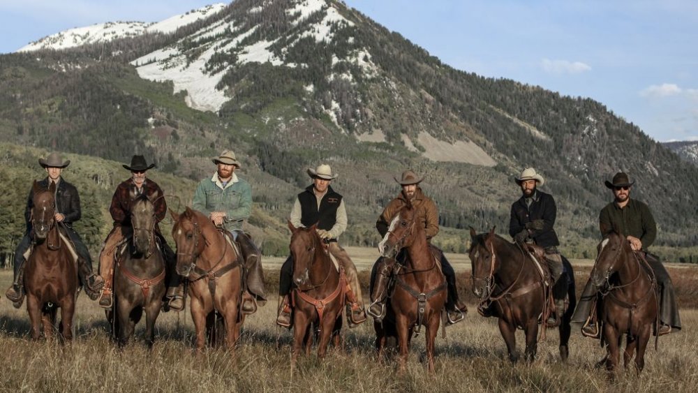 The cast of Yellowstone on horseback