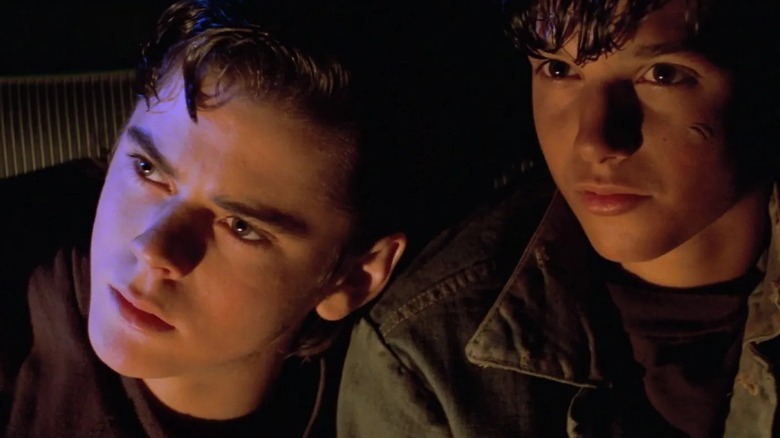 Ponyboy and Johnny in conversation in The Outsiders