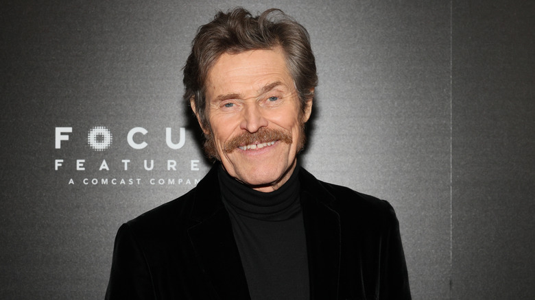 Willem Dafoe smiling