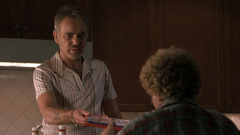 Willie (Billy Bob Thornton) hands an advent calendar to the Kid (Brett Kelly) in "Bad Santa"