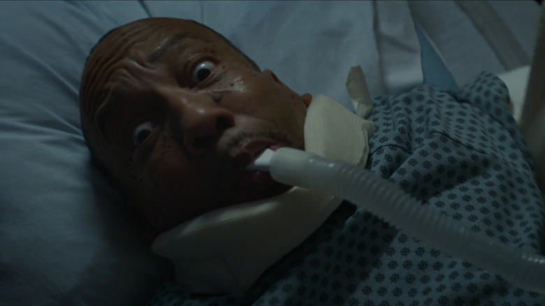 Marcus (Tony Cox) looking alarmed in a hospital bed in "Bad Santa 2"